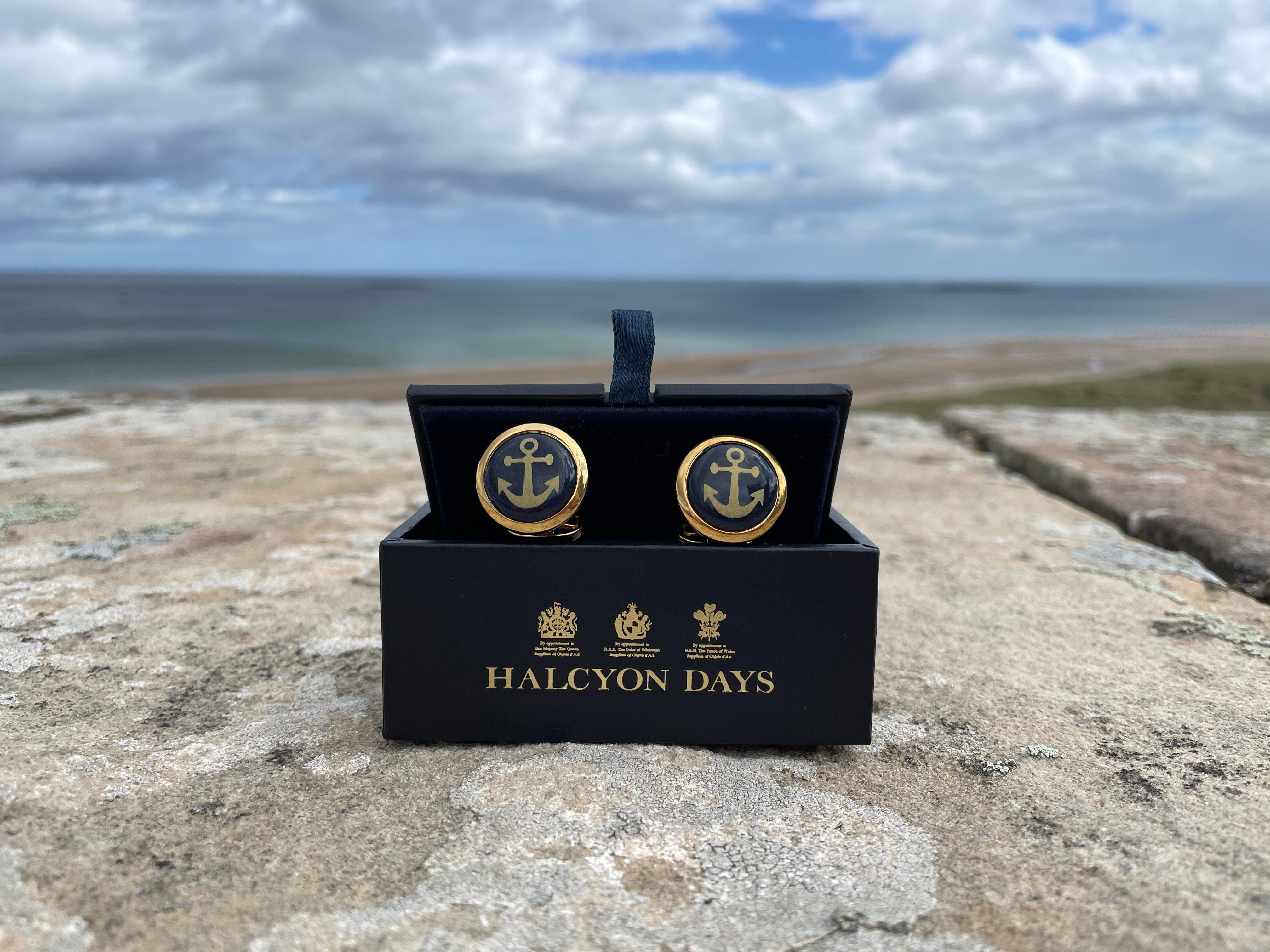 Cufflinks-on-a-wall-with-sea-in-the-background