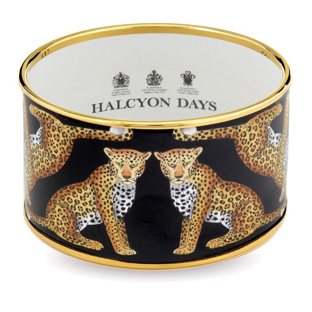 Women's enamel cuff bangle with illustrated leopards on a black background